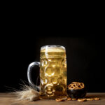 close up bavarian beer table with pretzels scaled